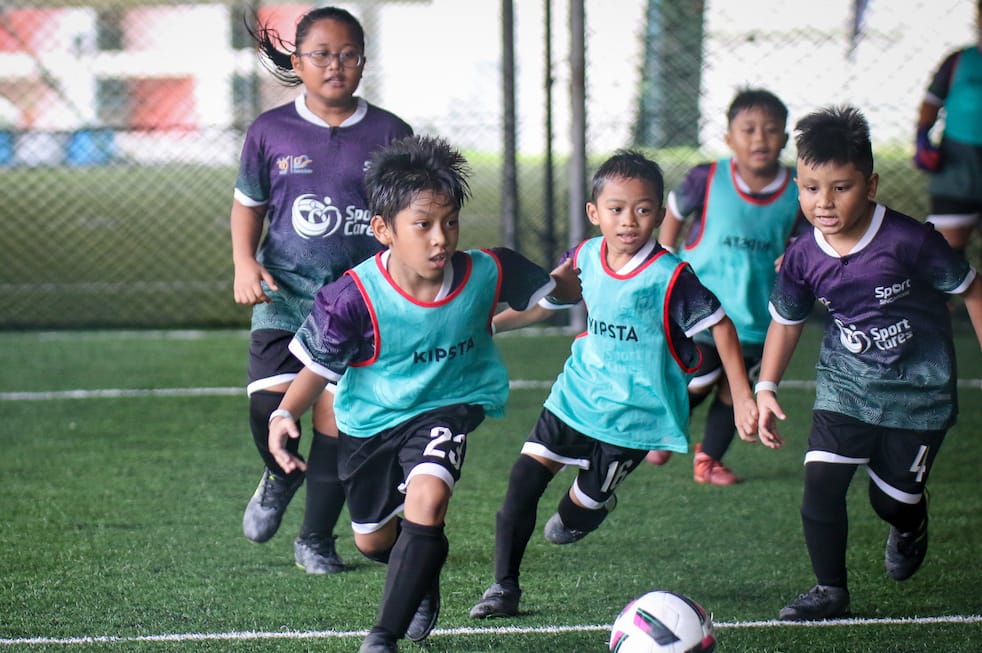 Youths playing futsal
